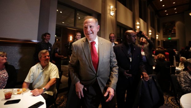 Former Alabama Chief Justice and US Senate candidate Roy Moore, greets supporters before his election campaign party in September.