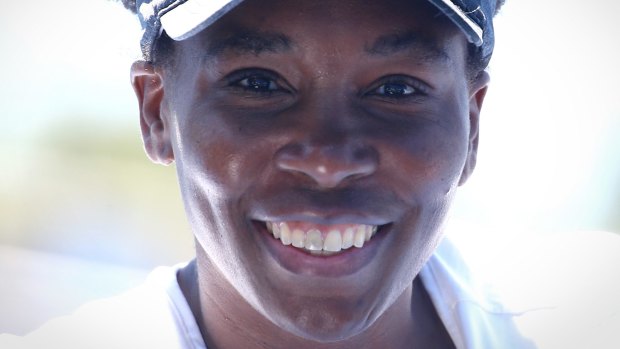 Still smiling: Venus Williams after a training session on Friday. 