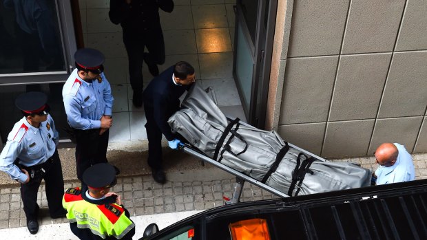 A body is removed from the Instituto Joan Foster in Barcelona.