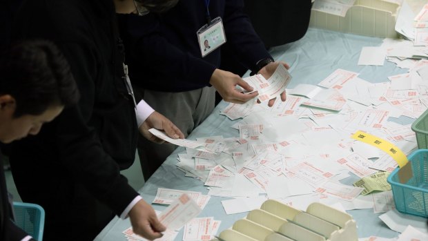 Electoral officials count ballots in Himeji, Hyogo, Japan, on Sunday.