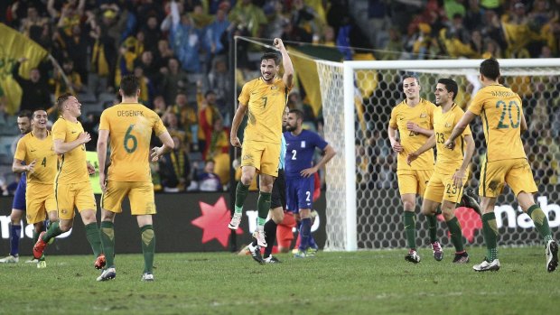 Rejoicing: Mathew Leckie pumps his fist after scoring the winning goal.