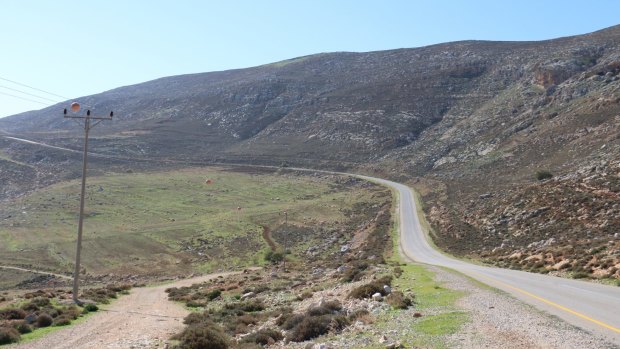A road through the hills of the Israeli-occupied West Bank, near one of the outposts raided by security forces investigating the attack on the Dawabshe family.