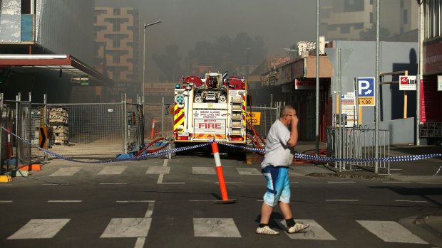 Firefighters fight the Little Saigon fire in Footscray this morning.