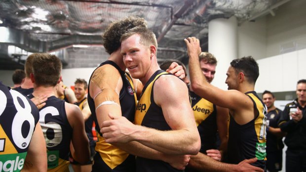 Brothers in arms: Ty Vickery and Jack Riewoldt enjoy a moment after the win.