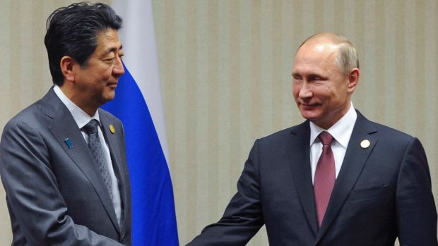 Japanese Prime Minister Shinzo Abe, left, with Russian President Vladimir Putin during their APEC meeting in Lima in November.