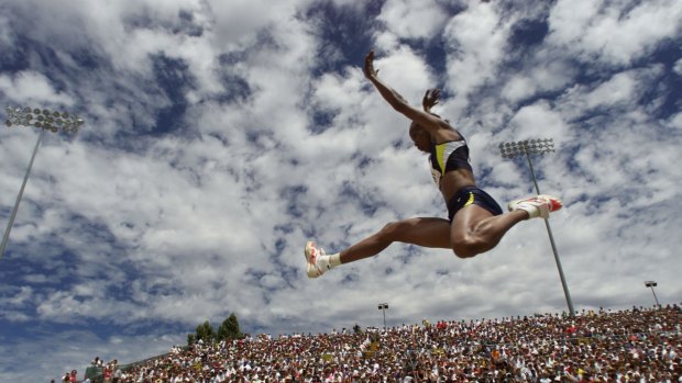 Olympic champion and all-time sporting legend Jackie Joyner-Kersee flies past the crowd.