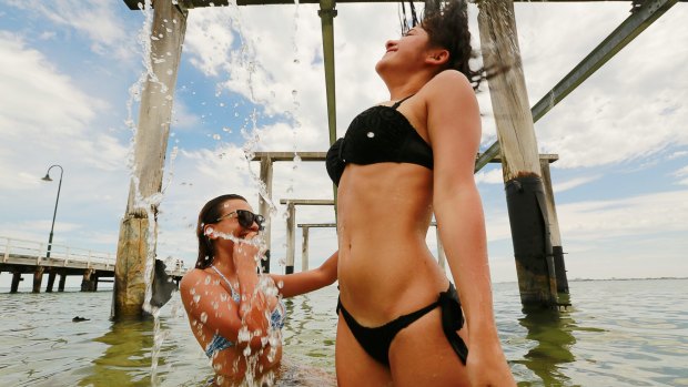 Natasha and Jessica of Greenvale cooling off at Kerferd Road Pier. 