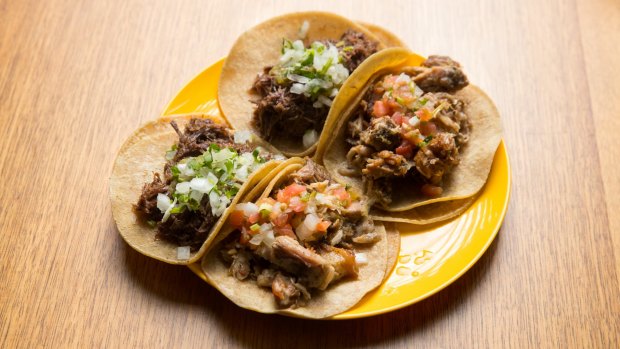 Al Pastor spiced pork and pineapple and carne asada, (grilled beef) and salsa verde.