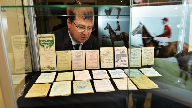 Max Williamson with orginal race books listing Phar Lap's races, all to be auctioned.