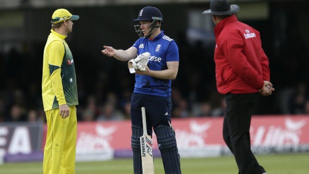 England's Eoin Morgan speaks to Australia's Steven Smith after England's Ben Stokes was adjudged out on appeal for obstructing the field.