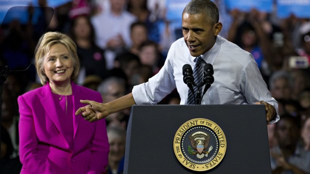 I'm with her: President Barack Obama and Hillary Clinton on Tuesday.