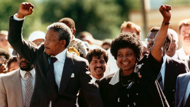 Nelson Mandela and his wife Winnie, walk hand in hand, raising clenched fists after his release from Victor Verster Prison, Cape Town, in 1990 after 27 years in detention.