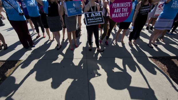 Demonstrators on both sides of the abortion issue stand on the footpath in front of the Supreme Court in Washington earlier this month. 