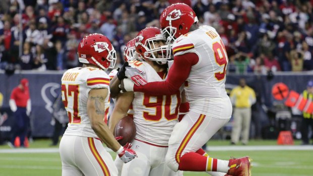 Nice catch: Kansas City Chiefs inside linebacker Josh Mauga celebrates with teammates after he intercepted a pass thrown by Houston Texans quarterback Brian Hoyer.