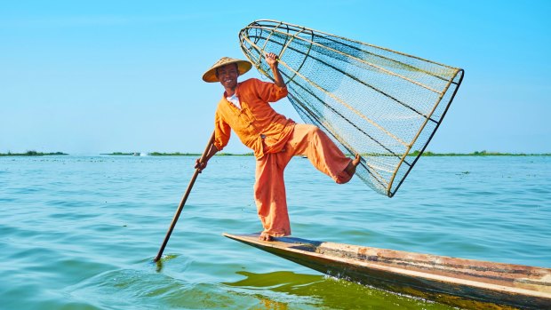 Some of the Intha leg rowers of Myanmar's Inle Lake now depend on tourists with cameras to supplement their income.