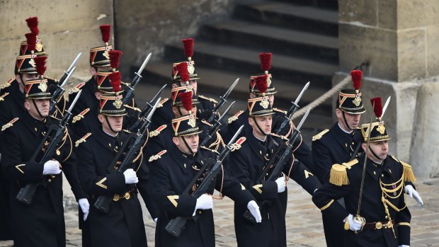 National guards march at the Les Invalides memorial in Paris on Friday. 