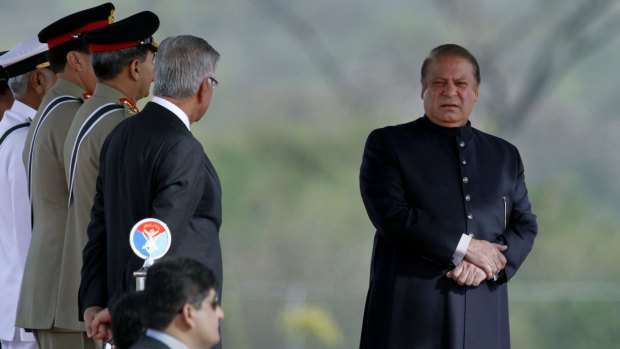 Pakistani Prime Minister Nawaz Sharif, right, attends a military parade to mark Republic Day in Islamabad in March. The parade included a display of nuclear-capable weapons, tanks, jets and drones.