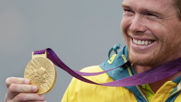 Australia's Tom Slingsby celebrates his gold medal of the laser class four years ago.