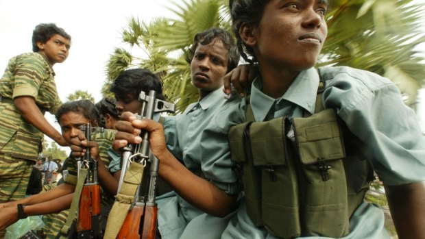 Tamil Tiger female Cadres searching for bodies on the beaches in the countries north province, parts of which were then  totally ruled by the rebels.