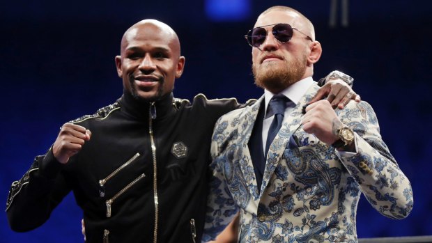 Floyd Mayweather jnr and Conor McGregor after the fight.