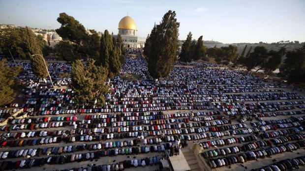 Palestinians pray during the Muslim holiday of Eid al-Adha, near the Dome of the Rock Mosque in the Al Aqsa Mosque compound in Jerusalem's old city. 