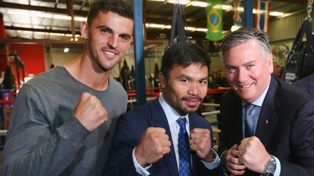 Big hit: Manny Pacquiao poses with Scott Pendlebury and Collingwood President Eddie Maguire during a press conference at Invictus Gym in Melbourne.