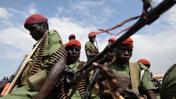 Soldiers from the opposition branch of the SPLA provide security for their chief of staff's arrival. 