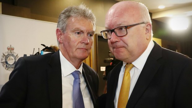 Attorney-General Senator George Brandis meets with ASIO Director-General of Security Duncan Lewis at AFP Commissioner Andrew Colvin's National Press Club address.