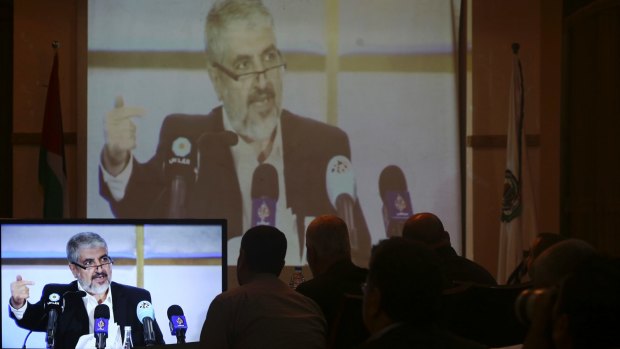 Hamas leaders and supporters in Gaza City listen to Khaled Mashaal, the outgoing Hamas leader, launch a new manifesto from Doha, Qatar, in May.