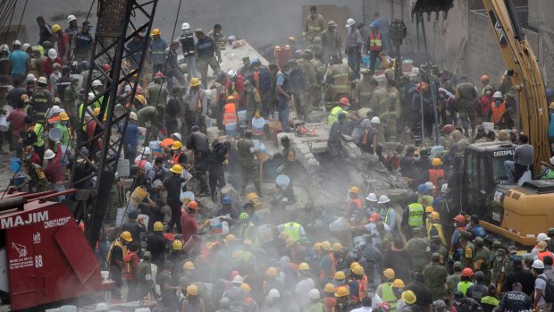 Emergency personnel search for survivors in a collapsed building in Mexico City on Wednesday.