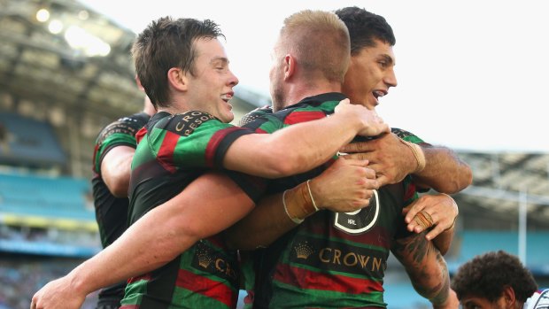 Well done: Luke Keary and Kyle Turner congratulate Aaron Gray.