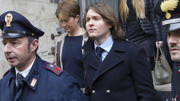 Raffaele Sollecito, centre, leaves Italy's highest court in Rome on Friday.