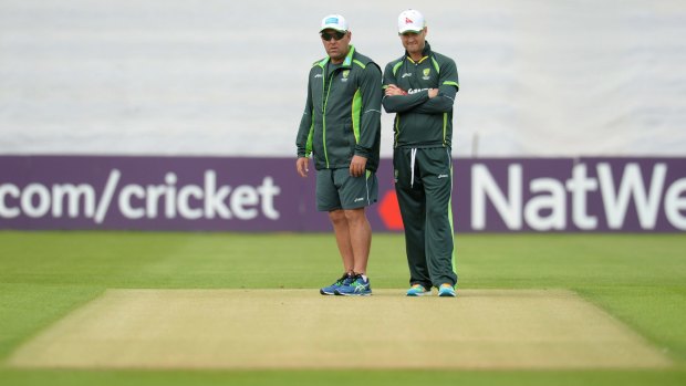 Check the deck: Coach Darren Lehmann and captain Michael Clarke inspect the Cardiff pitch.