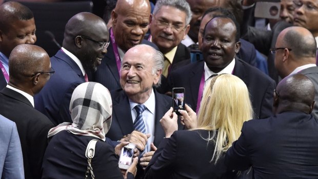 FIFA President Sepp Blatter is greeted by delegates after being re-elected to the FIFA presidency on Friday.