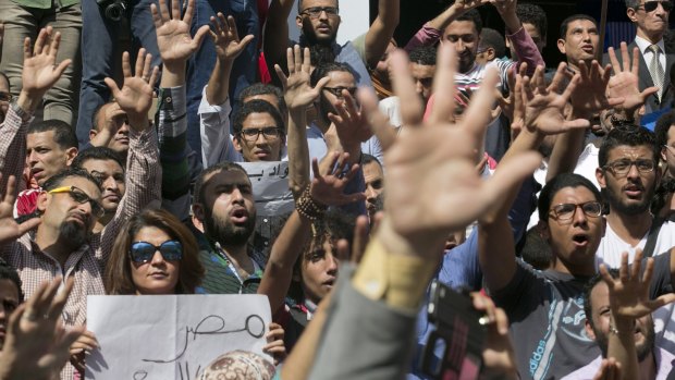 Egyptians gather in Cairo to shout slogans against Egyptian President Abdel-Fattah al-Sisi at a protest condemning the decision to hand over control of two strategic Red Sea islands to Saudi Arabia.