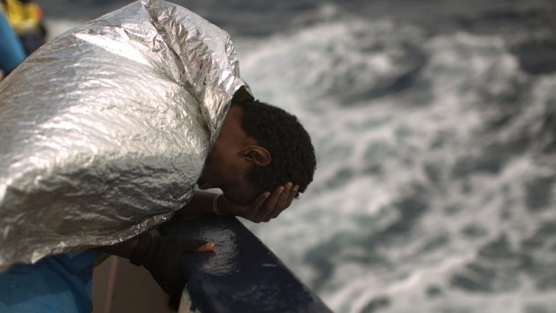 A sub-Saharan migrant on the deck of the Golfo Azzurro boat after he was rescued from a rubber boat on the Mediterranean off Libya.