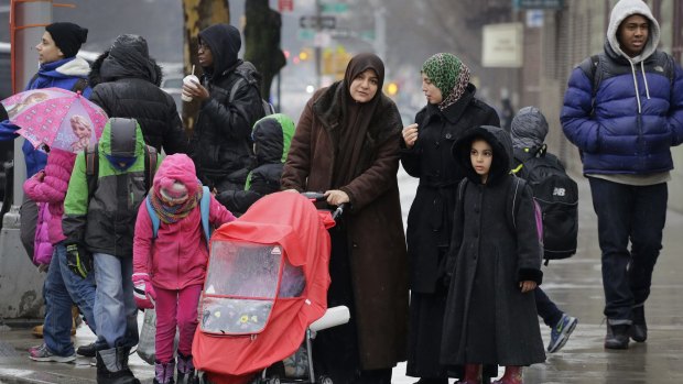 Muslim women with their children in Brooklyn on Wednesday. New York City mayor Bill de Blasio announced that schools will close for the Islamic holiday of Eid al-Adha for the first time in September.  