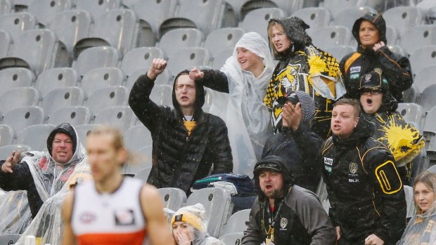 Tigers fans react after a decision during the round 18  match between Richmond and the Greater Western Sydney Giants.