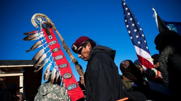 Native American veterans join an interfaith ceremony at the Oceti Sakowin camp where people gathered to protest the Dakota Access oil pipeline in Cannon Ball.