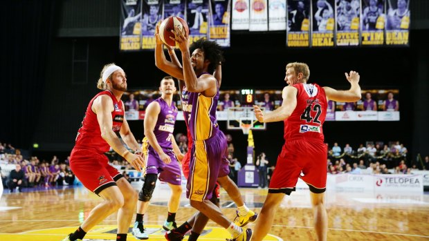 Heated rivalry: Josh Childress blows by Jesse Wagstaff to score during last season's clash in Sydney.