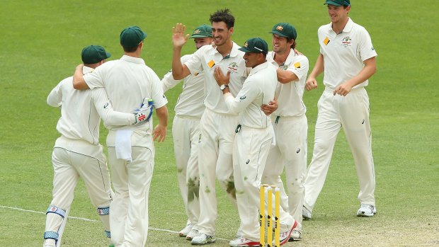 Happy day:  Australia celebrate their victory over New Zealand at The Gabba .