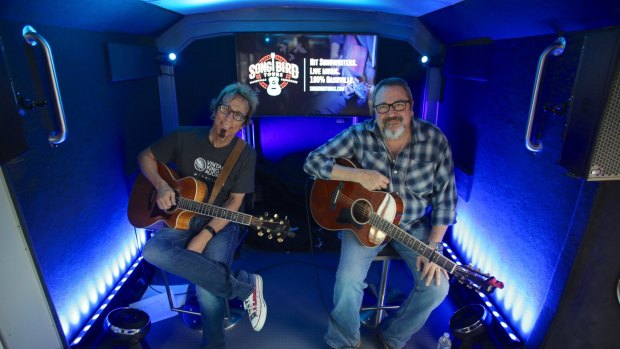 Performers Trey Bruce and Tommy Conners on the live music tour bus.