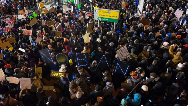 Protesters assemble at John F. Kennedy International Airport in New York after  two Iraqi refugees were detained while trying to enter the country. 