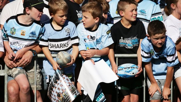 Great expectations: Young Sharks fans wait to greet their idols at a fan day this week.