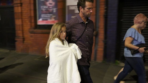 A young music fan leaves the arena following the attack. 