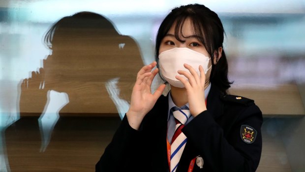 An airport staff member wears a mask at Incheon International Airport in South Korea.