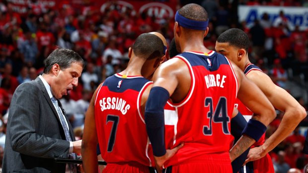 Barking instructions: Randy Wittman huddles his players during a timeout against the Atlanta Hawks.