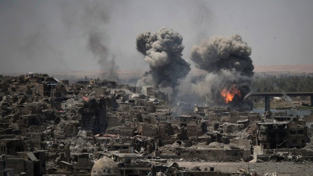 Airstrikes target Islamic State positions on the edge of the Old City in Mosul, Iraq in July.
