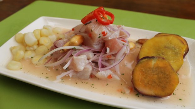 Ceviche with corn and sweet potato slices.