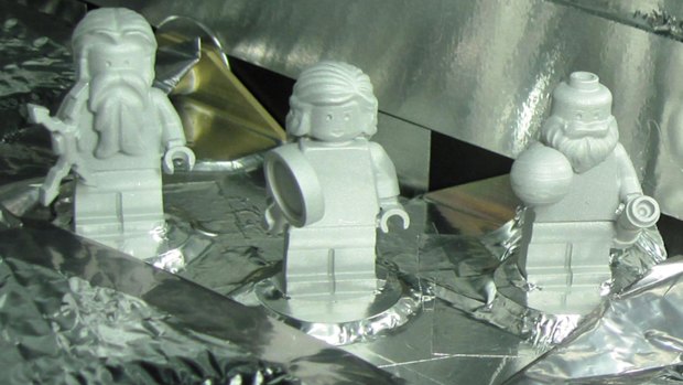 Lego figurines representing, from left, the Roman god Jupiter, his wife, Juno, and Galileo Galilei aboard the Juno spacecraft. The figures are made of aluminium so they can withstand the extreme conditions of space flight.

 